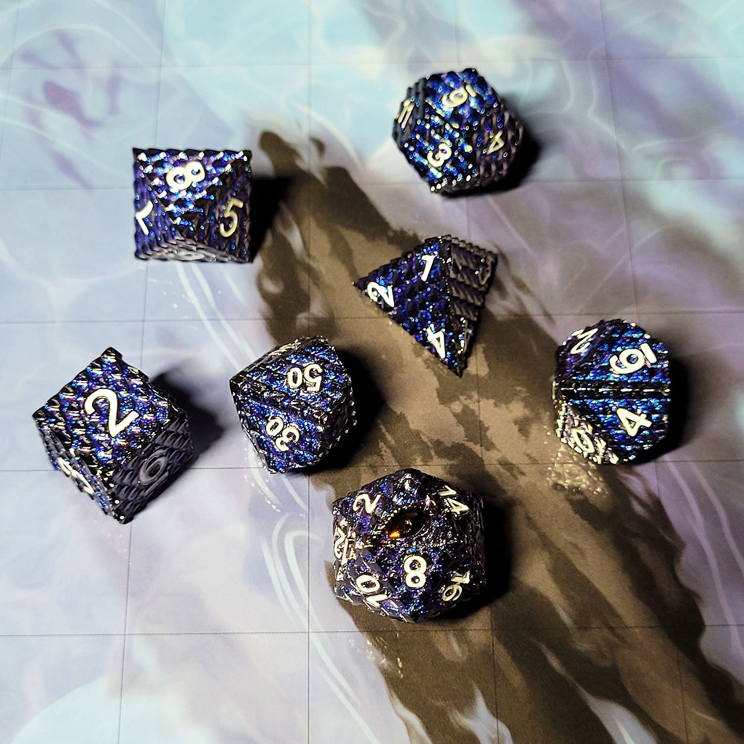 The in an environmental image of the Forged Gaming Dragon's Gaze Shimmering Blue Metal RPG Dice Set. The photo was taken using the Open Water Encounter Map as a background.