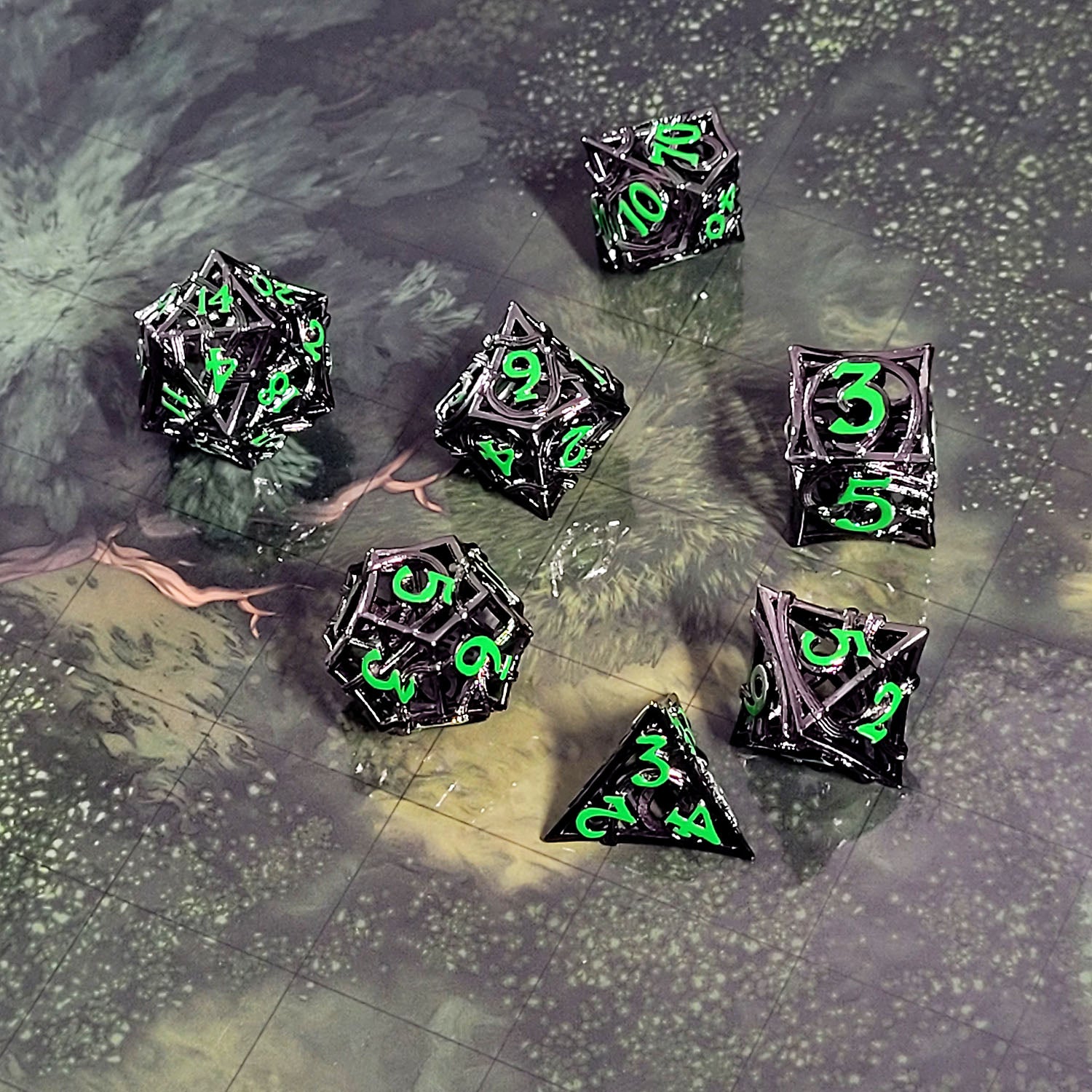 This is an environmental image of the Forged Gaming Entangled Fate Silver Green Hollow Metal RPG Dice Set. The photo was taken using the Wooded Forest Encounter Map as a background.