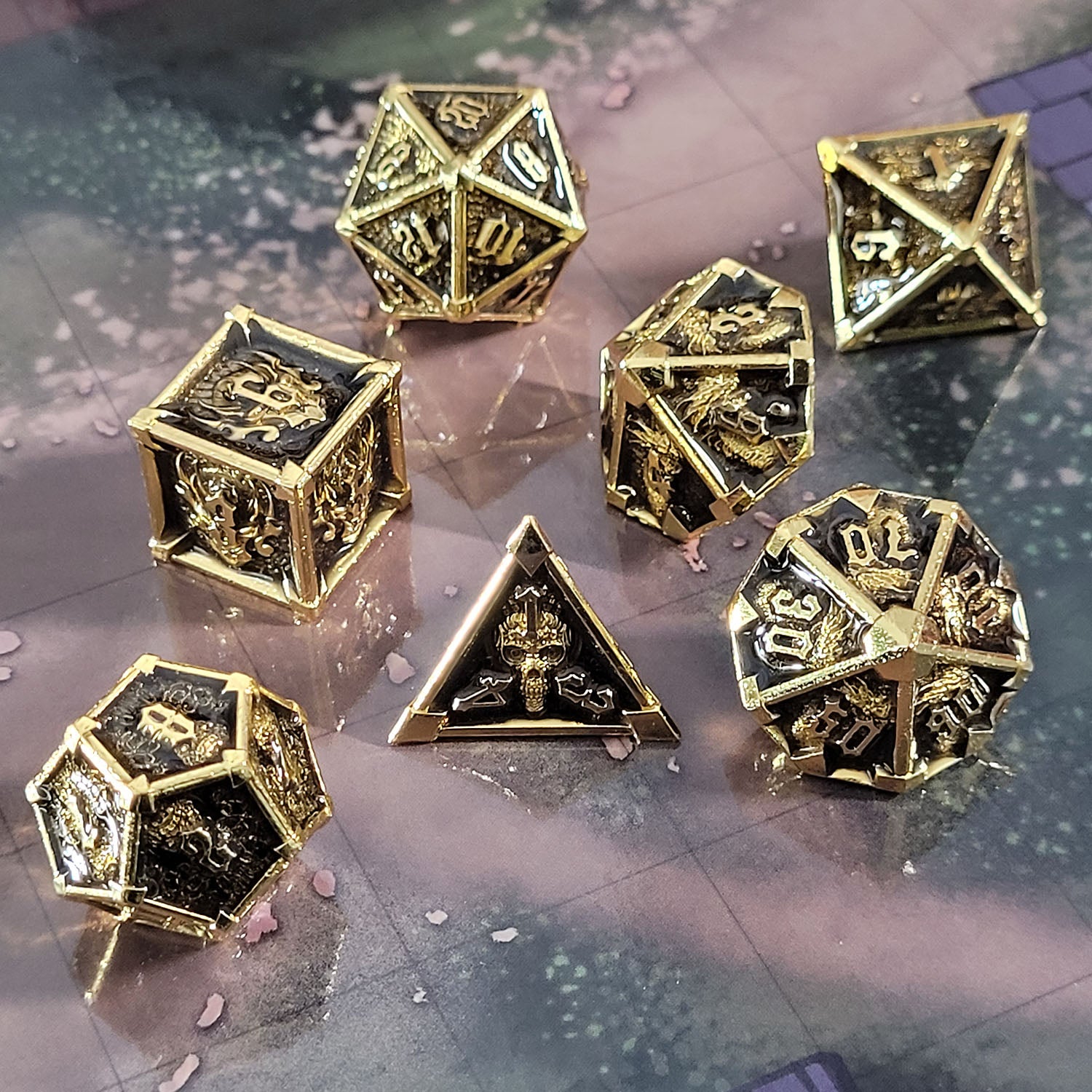 This is an environmental image of the Forged Gaming Ossuary Obscura Gold Metal RPG Dice Set. The photo was taken using the Wooded Forest Encounter Map as a background.