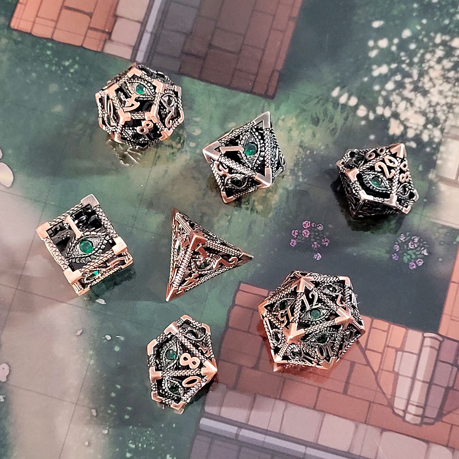 This is an environmental image of the Forged Gaming Serpent's Eye Copper Hollow Metal RPG Dice Set. The photo was taken using the City Streets Encounter Map as a background.