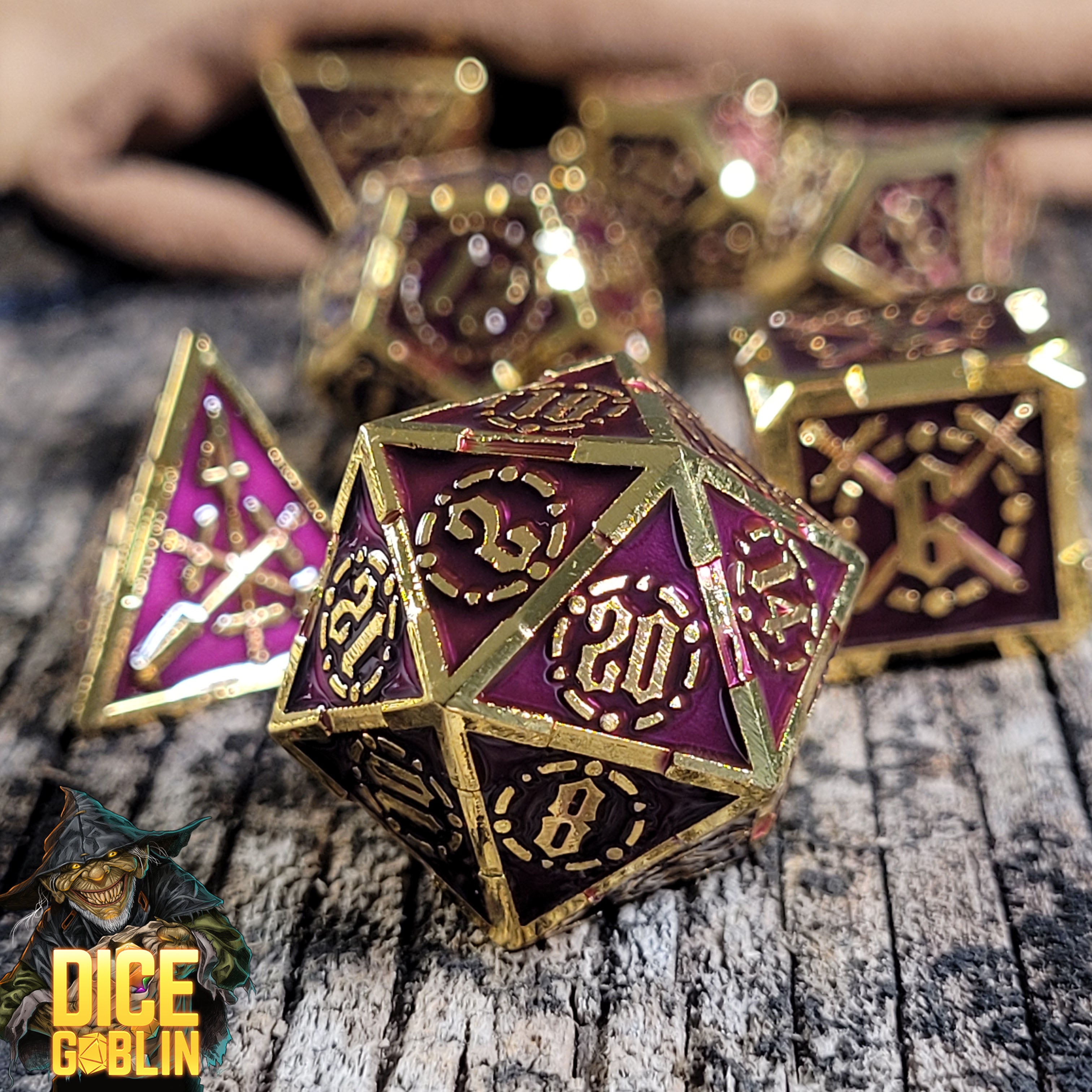 This is an environmental image of the Dice Goblin Swords Gold with Red Metal RPG Dice Set on a distressed wood surface.