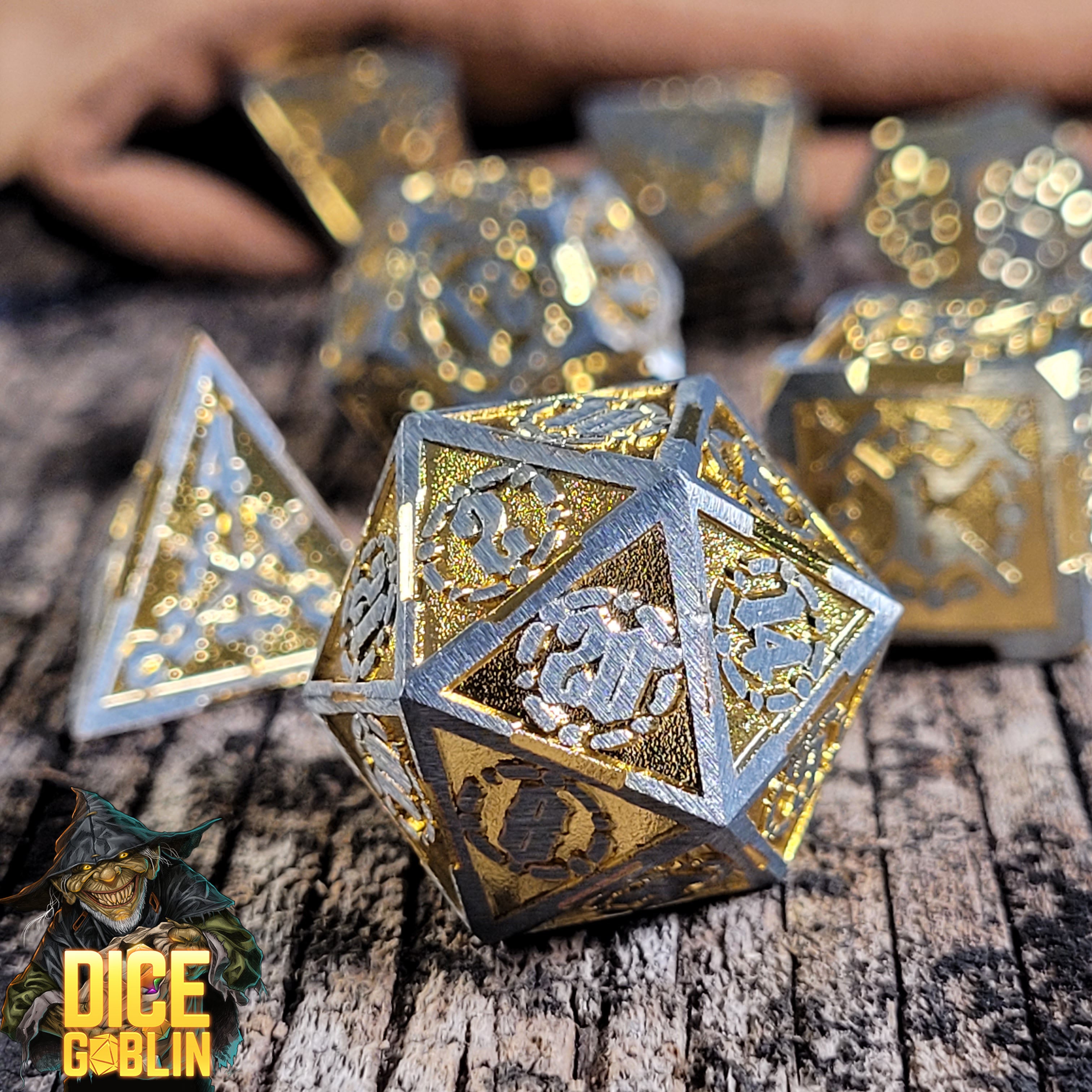 This is an environmental image of the Dice Goblin Swords Silver with Gold Metal RPG Dice Set on a distressed wood surface.