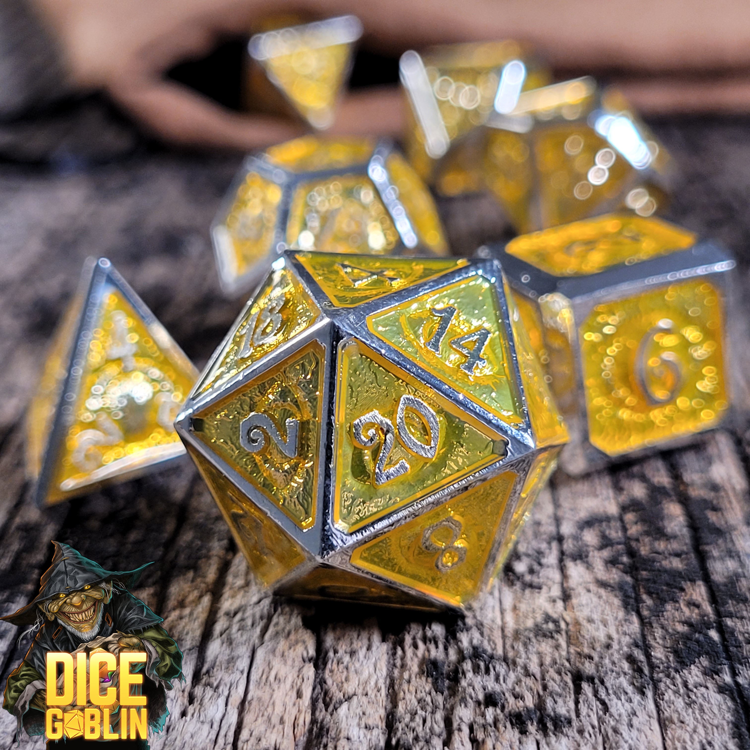 This is an environmental image of the Dice Goblin Eyes Silver with Foiled Gold Metal RPG Dice Set on a distressed wood surface.