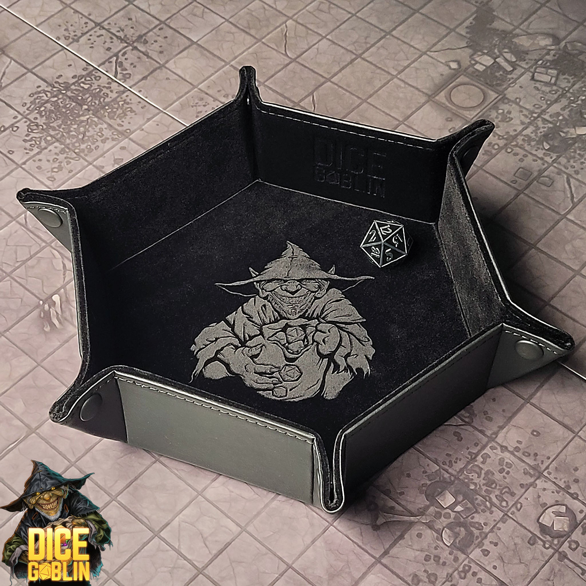 This is an environmental image of the Black colored Dice Goblin Hexagon folding Snap Dice Tray with a dungeon encounter map as a background.