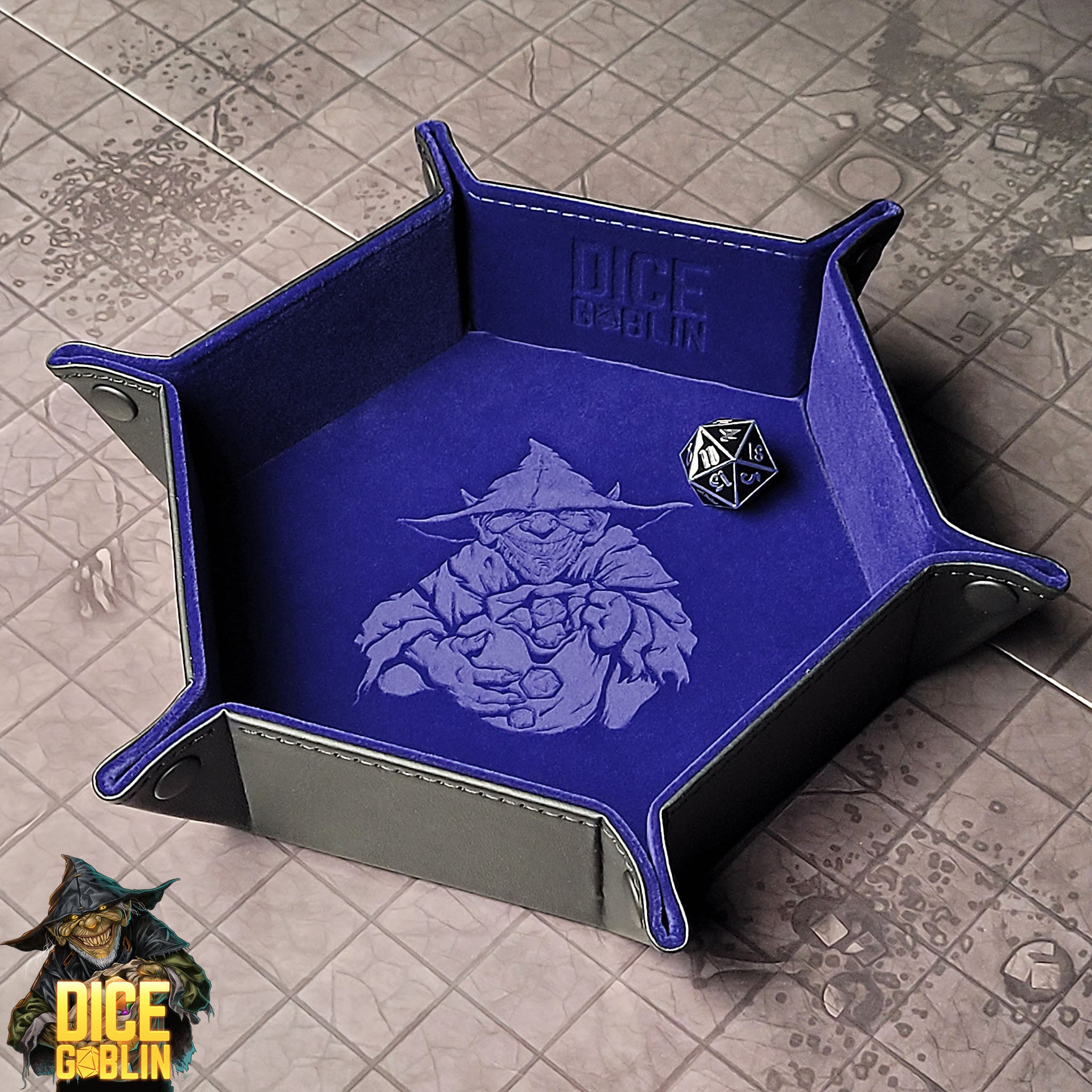 This is an environmental image of the Blue colored Dice Goblin Hexagon folding Snap Dice Tray with a dungeon encounter map as a background.