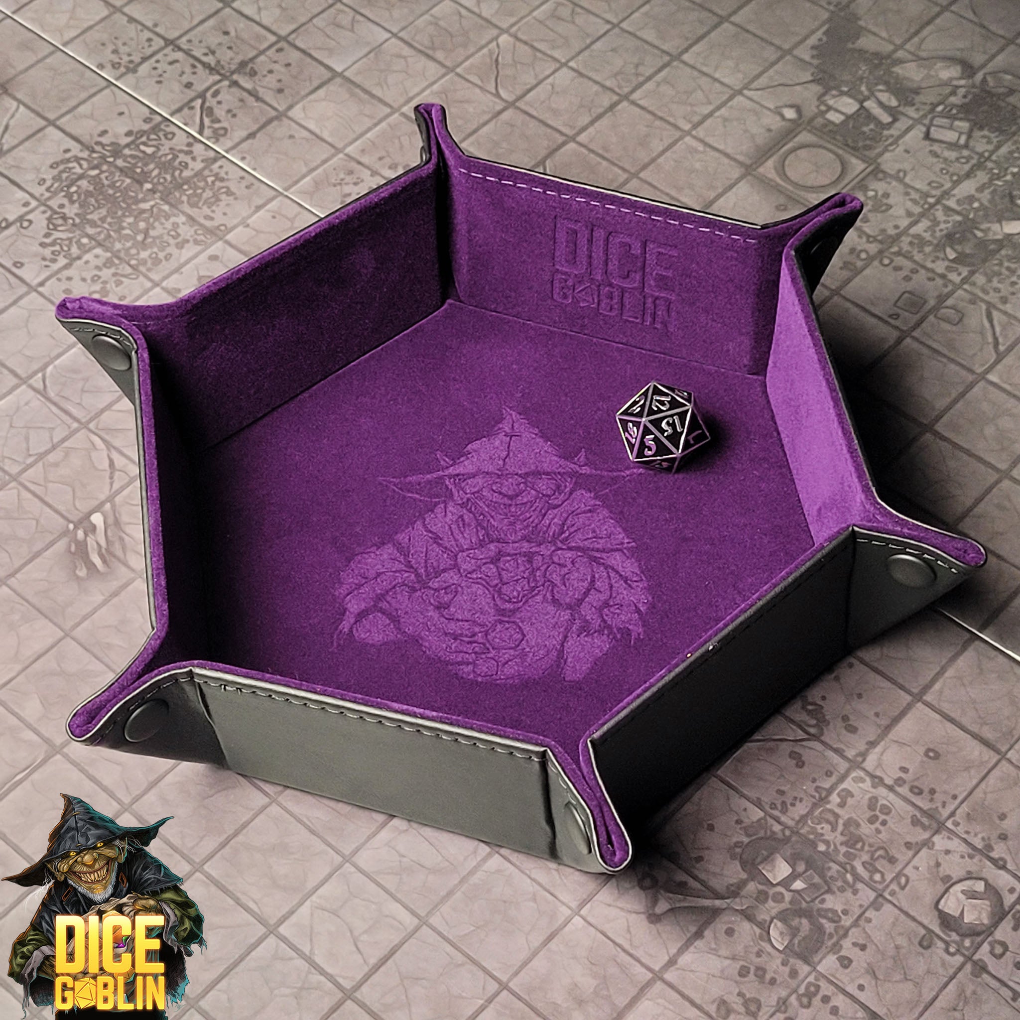This is an environmental image of the Purple colored Dice Goblin Hexagon folding Snap Dice Tray with a dungeon encounter map as a background.