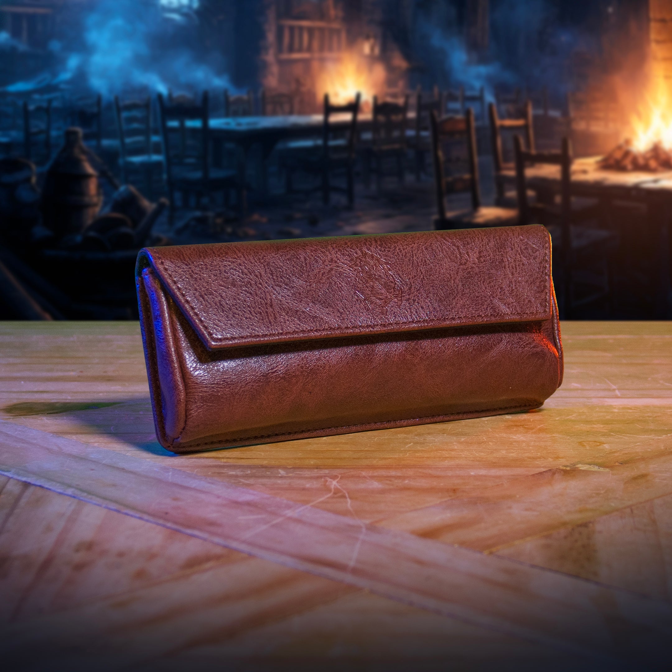 This is an environmental image of the brown version of the Ultimate Game Master Screen Large Pouch displayed on a table.