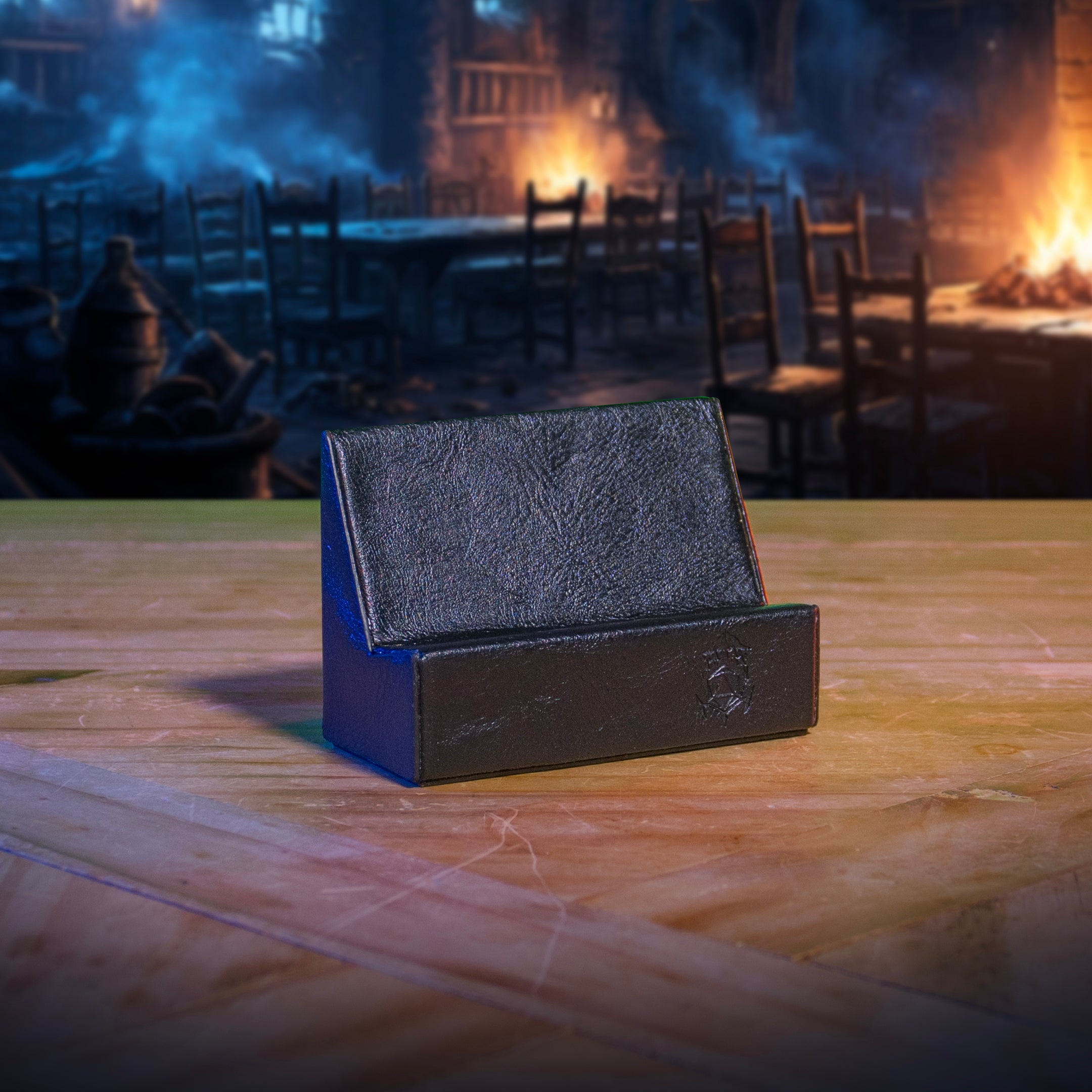 This is an environmental image of the back version Ultimate Game Master Screen Phone Holder displayed on a table.