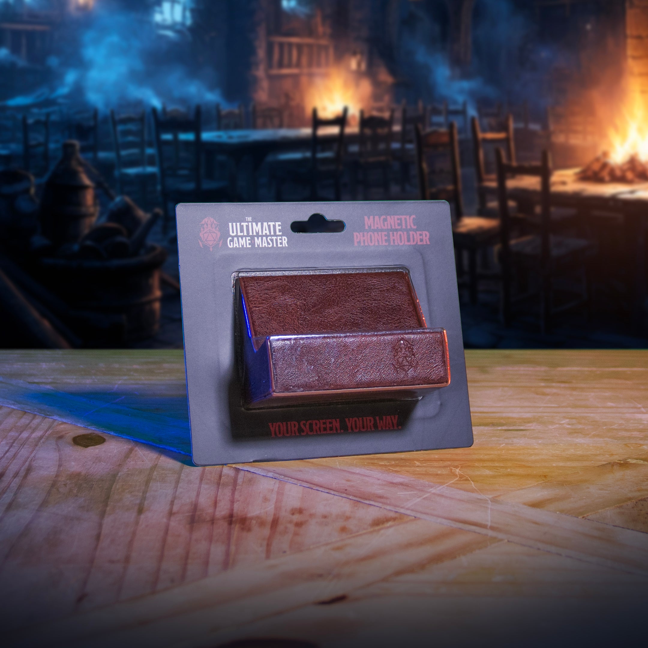 This is an environmental image of the brown version Ultimate Game Master Screen Phone Holder displayed on a table.