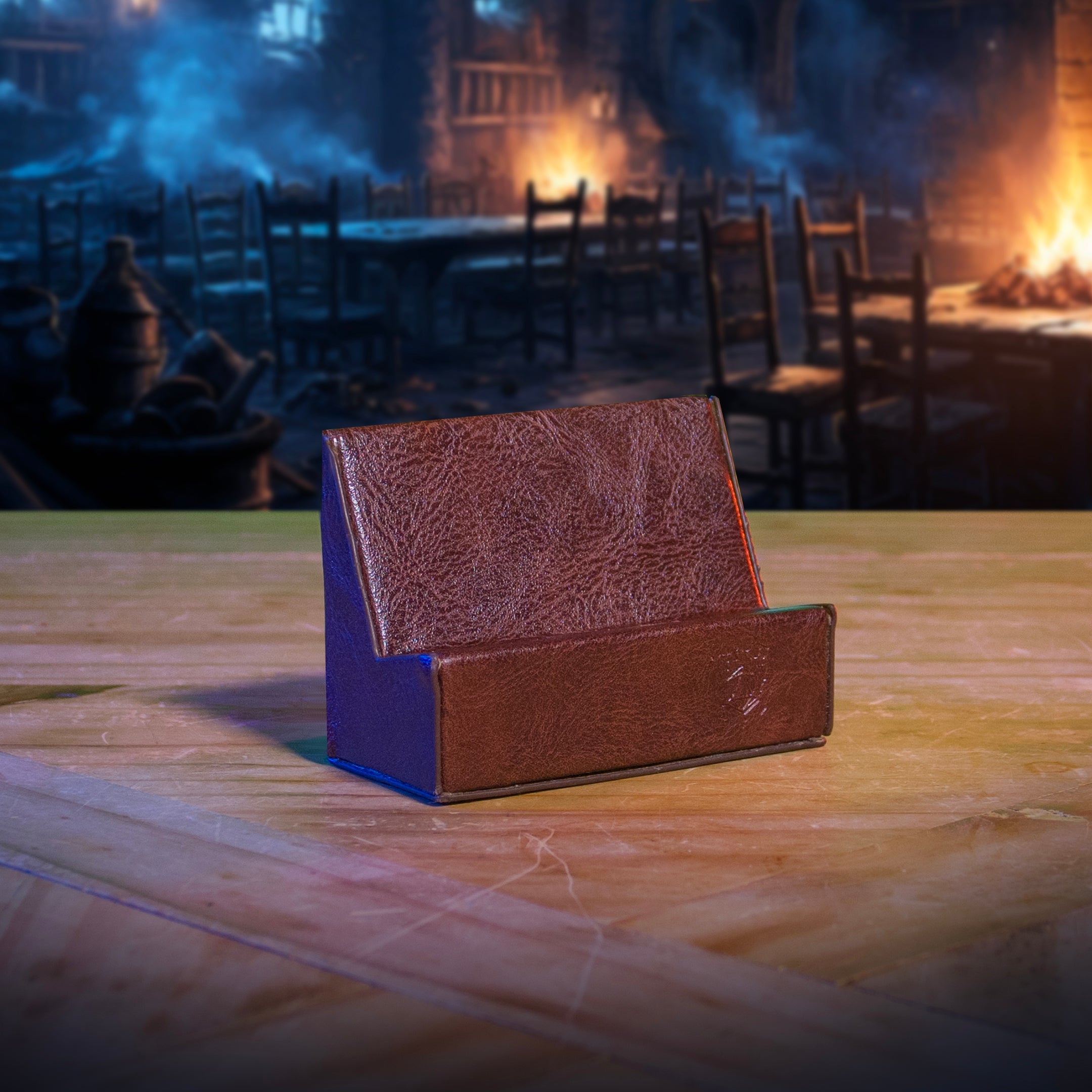 This is an environmental image of the brown version Ultimate Game Master Screen Phone Holder displayed on a table.