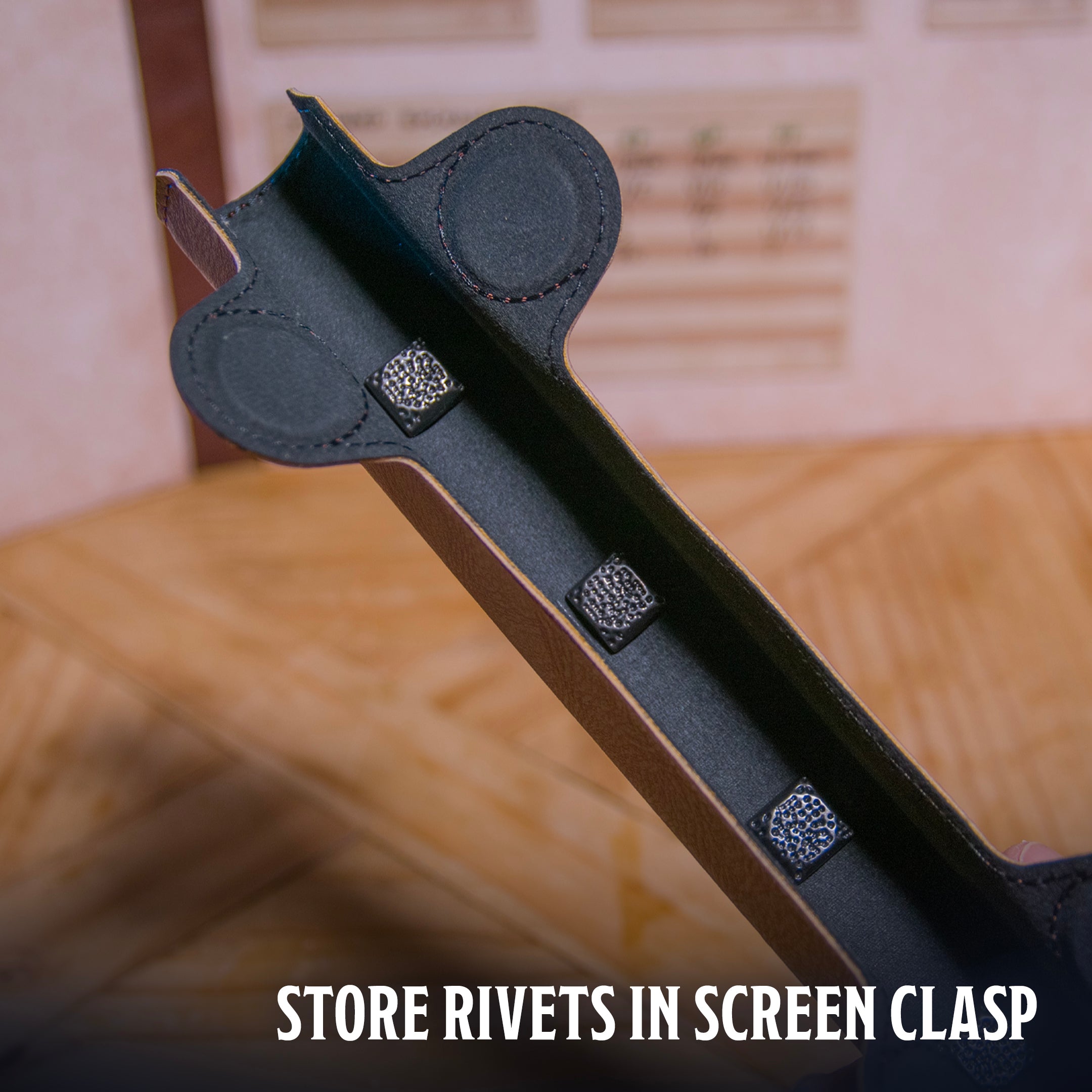 Environmental photo of  the Ultimate Game Master Screen Rivet Magnets demonstrating their storage in the screen clasp.
